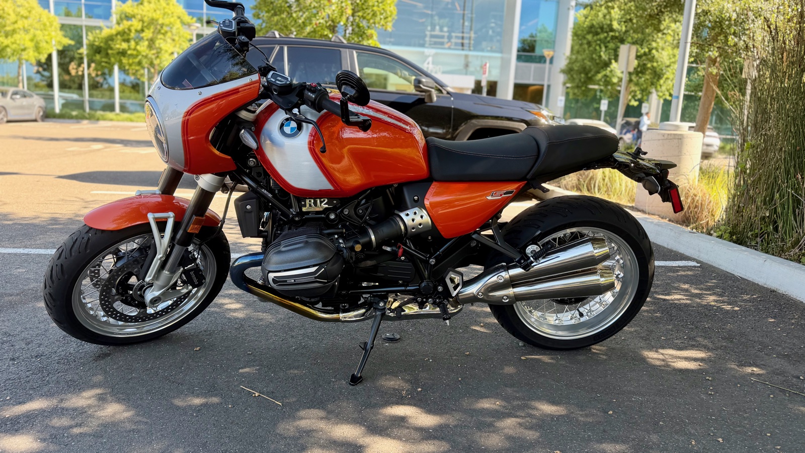 Left profile showing twin brushed exhaust silencers